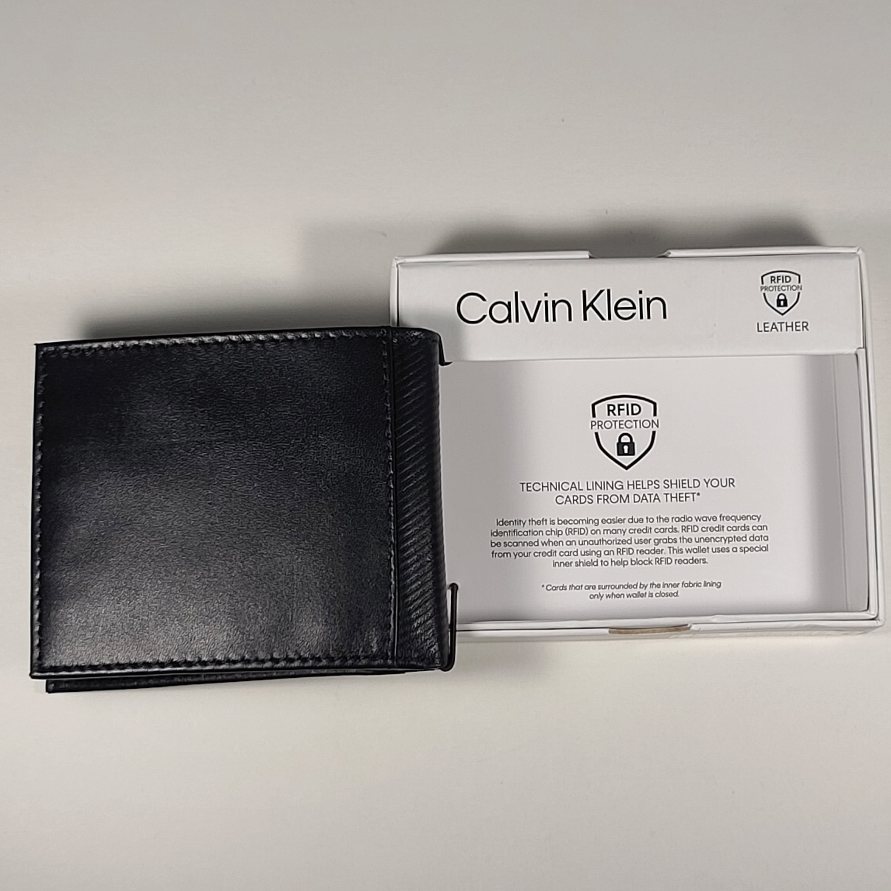 Calvin Klein Men s Bifold Black Leather RFID Passcase Wallet 31KA22003 TheSunglassFashion