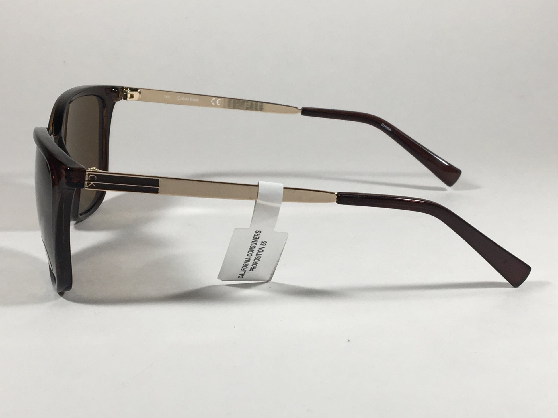 Calvin Klein R713S 210 Rectangle Navigator Sunglasses Brown Gold Frame Brown Lens - Sunglasses