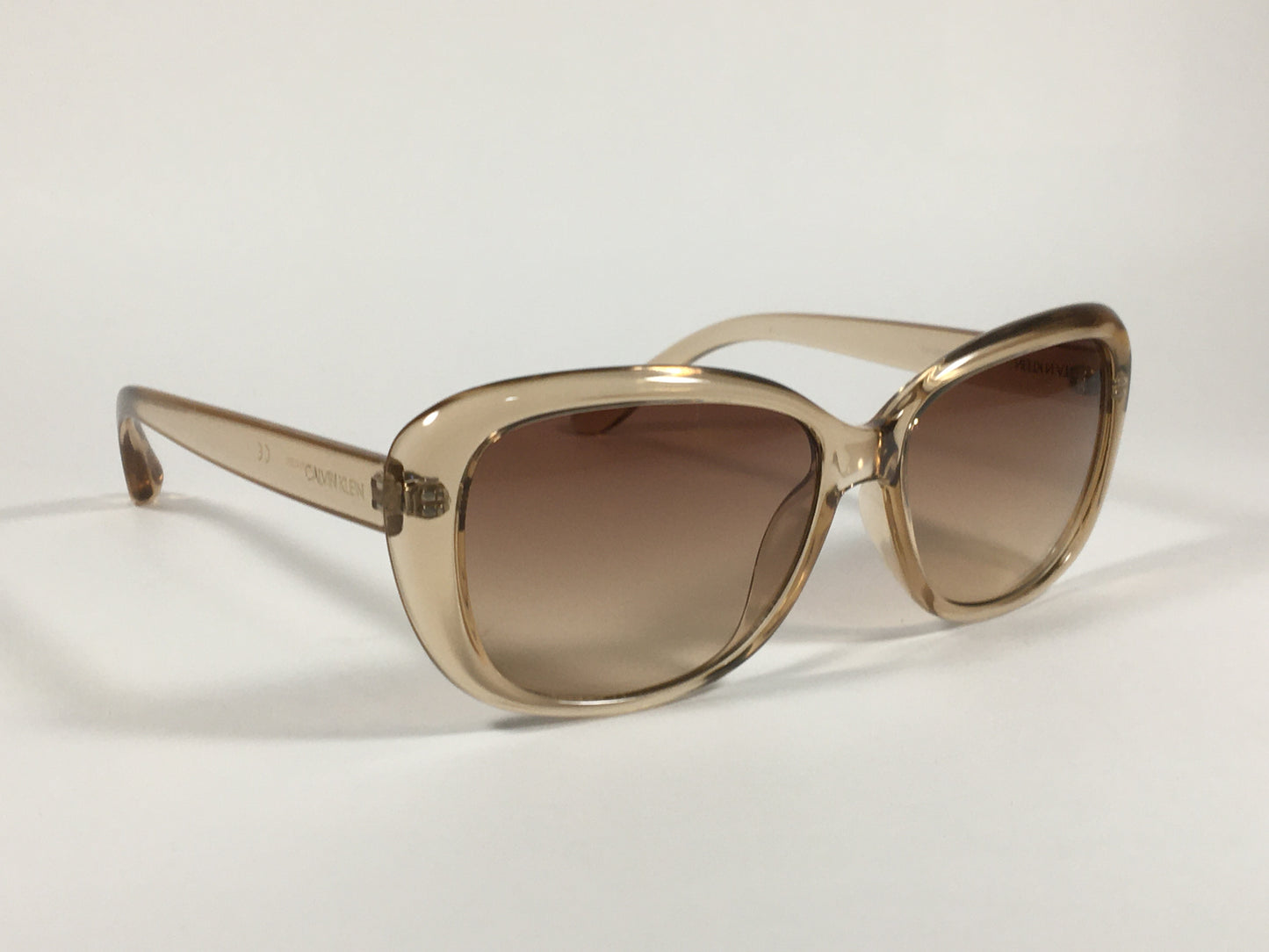 Calvin Klein Oval Sunglasses CK19541S 270 Light Brown Crystal Frame Brown Gradient Lens - Sunglasses